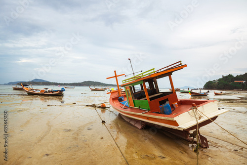 THAILAND  PHUKET  ASIA - FEBRUARY 1  2017  Thai old fishing small boat at low tide in the shallows.