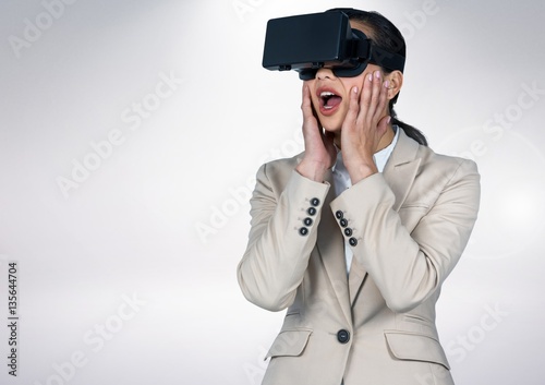 Shocking businesswoman using virtual reality headset