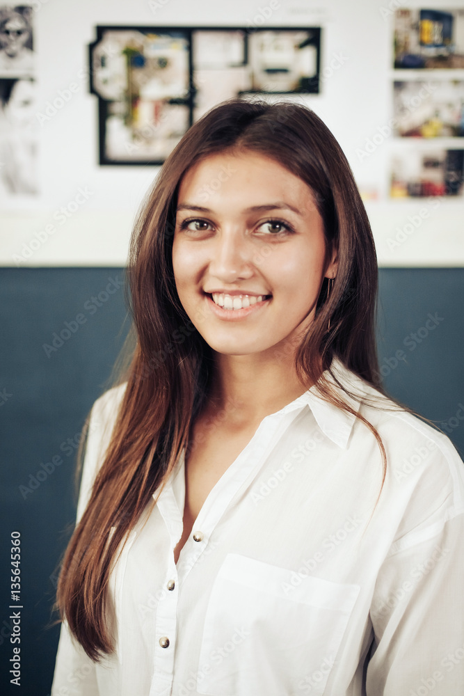 Fototapeta premium Casual business woman looking happy and smiling