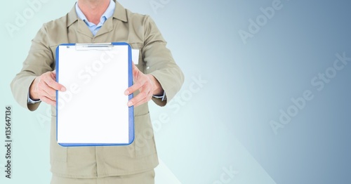 Mid section of delivery man standing with clipboard