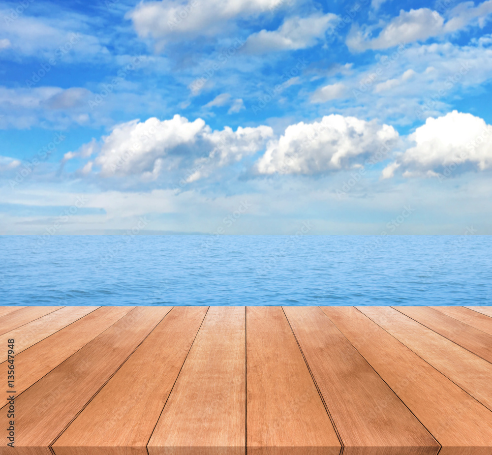 Wood table top on blue sky and seascape background