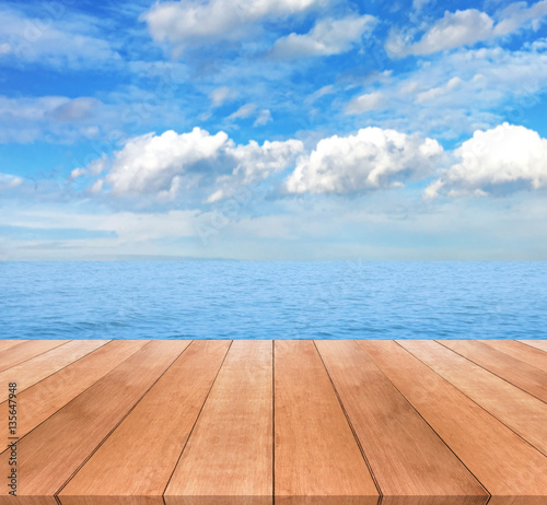 Wood table top on blue sky and seascape background