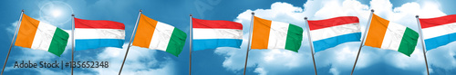 Ivory coast flag with Luxembourg flag, 3D rendering