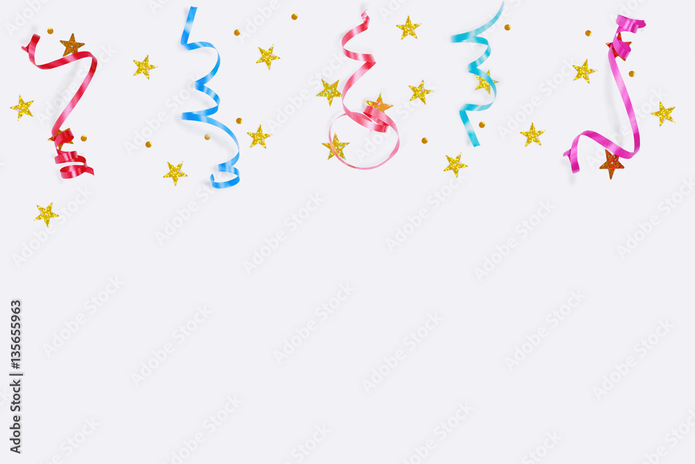 Colorful confetti stars, streamers on a light background.