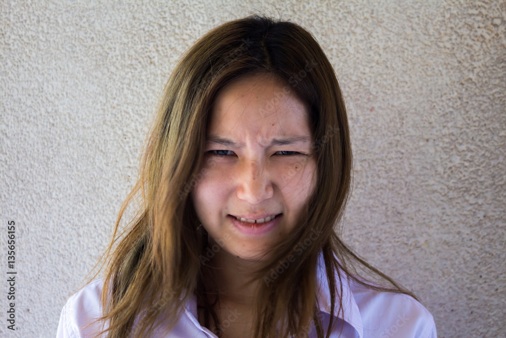 portrait of cute beautiful Angry young girl looking laugh loudly isolated grey portrait of cute beautiful Angry young girl looking laugh loudly isolated grey