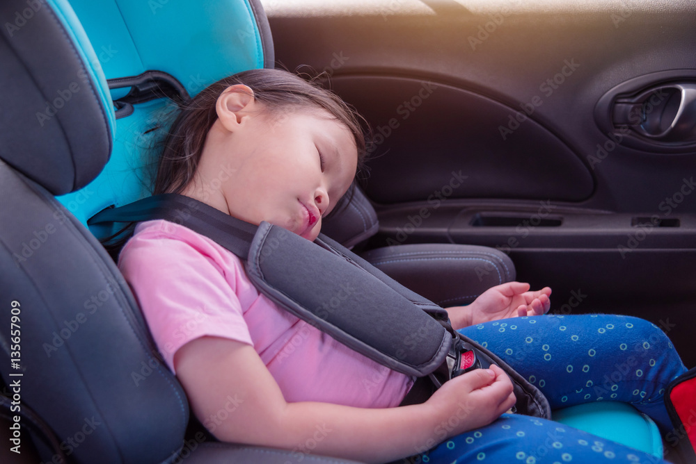 Little asian girl sleeping on carseat in car Little asian girl sleeping on carseat in car