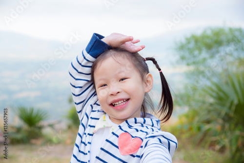 Little asian girl smiling outdoor