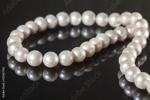 Pearl necklace on a dark background