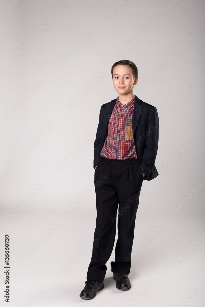 Studio portrait of businessman boy in suit Studio portrait of businessman boy in suit