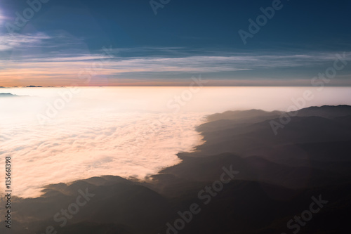 Sea of clouds flow over mountains with scenery view