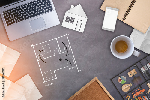 house design concept with working stuff laptop notebook coffee cup and paper note with free copyspace for your text