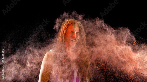 teen girls have fun with colored holi powder