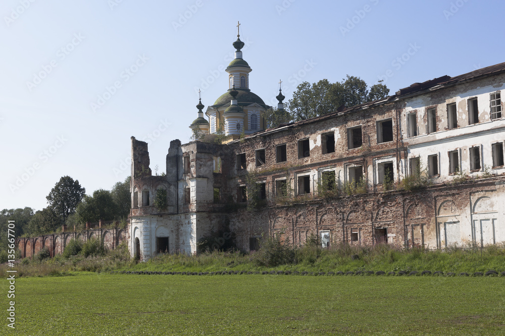 Crumbling walls of the monastery Spaso-Sumorin and dome of the Cathedral Ascension of the Lord in the town of Totma, Vologda Region, Russia
