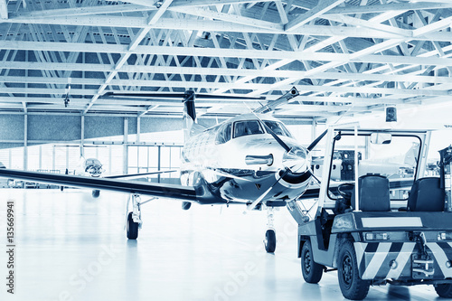 Single turboprop aircraft  in hangar. 