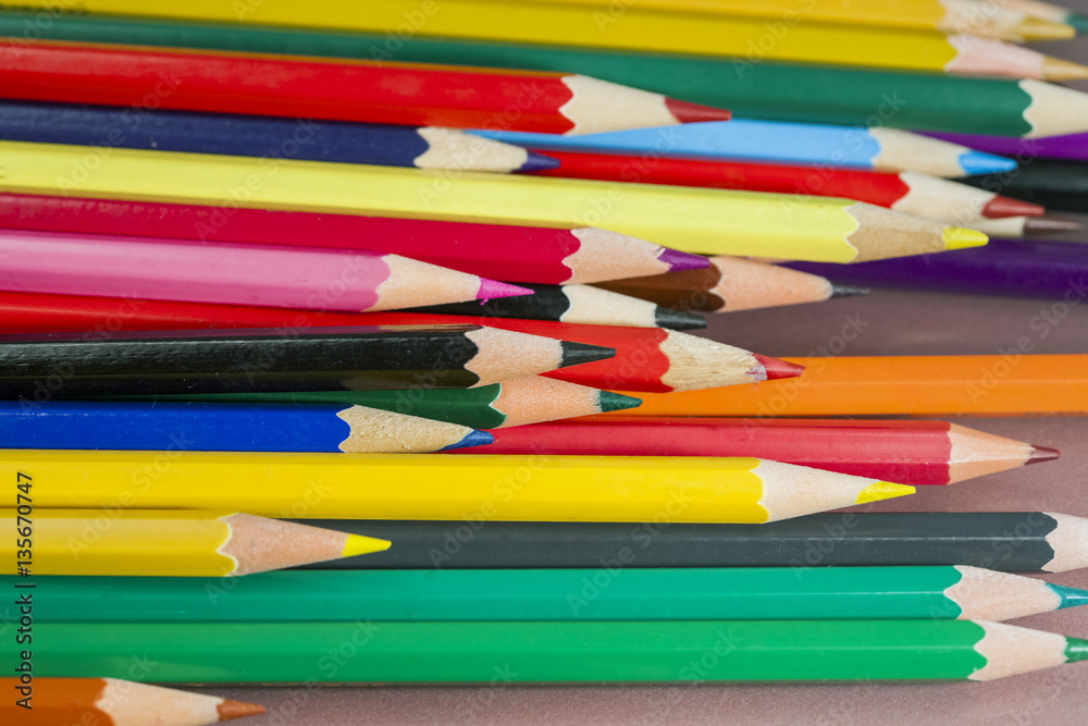 Group of colored pencils with white background and reflexions Group of colored pencils with white background and reflexions