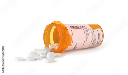 Canvas-taulu white pills in yellow bottle isolated
