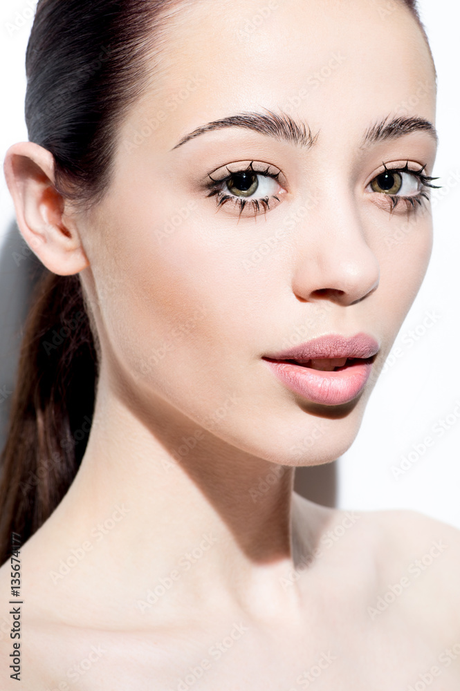 Fototapeta premium Closeup portrait of beautiful young woman with creative makeup