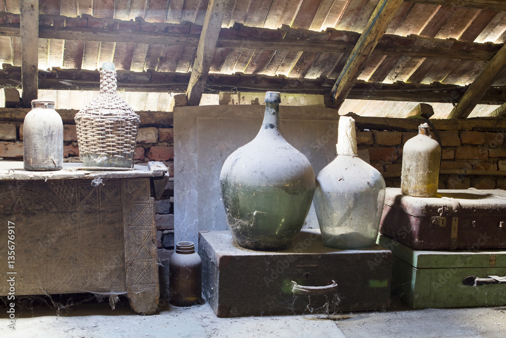Glass, wooden and metallic objects in the attic with dust and spiderwebs in a beautiful, moody light
Glass, wooden and metallic objects in the attic with dust and spiderwebs in a beautiful, moody light