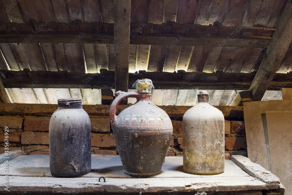 Glass, wooden and metallic objects in the attic with dust and spiderwebs in a beautiful, moody light
Glass, wooden and metallic objects in the attic with dust and spiderwebs in a beautiful, moody light