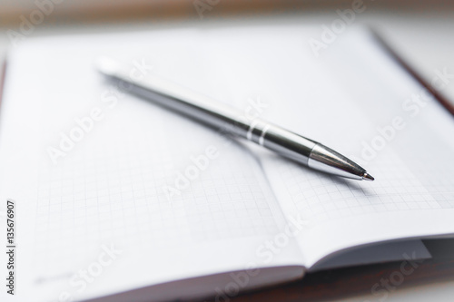 Notebook and Pen, Notebook and pen on white background.