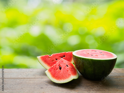 Fresh watermelon slice on wooden table of natural background