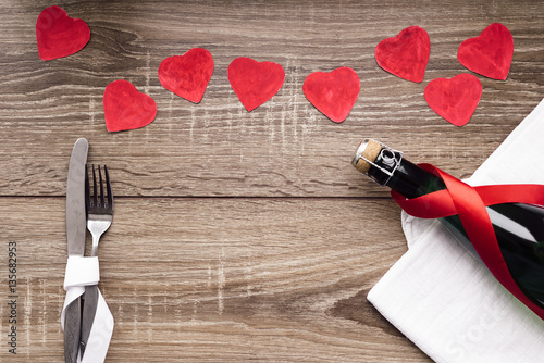 Bottle of wine on the wooden table photo