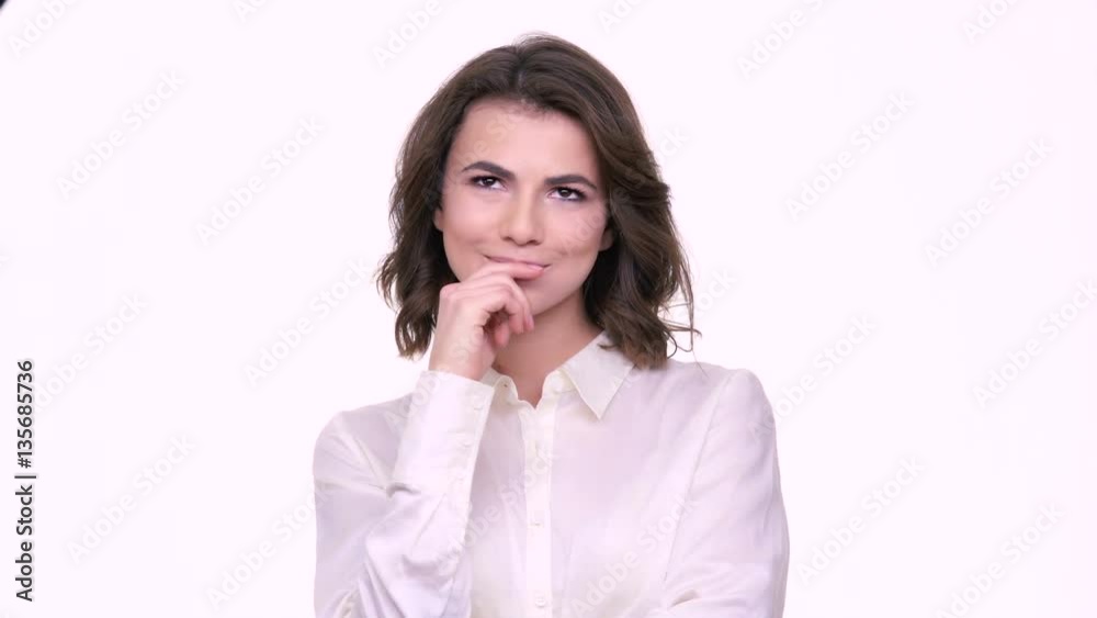 Young pensive woman looking away at copyspace isolated on a white background Young pensive woman looking away at copyspace isolated on a white background