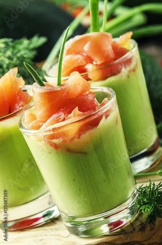 Appetizer with smoked salmon and avocado mousse, served in glass