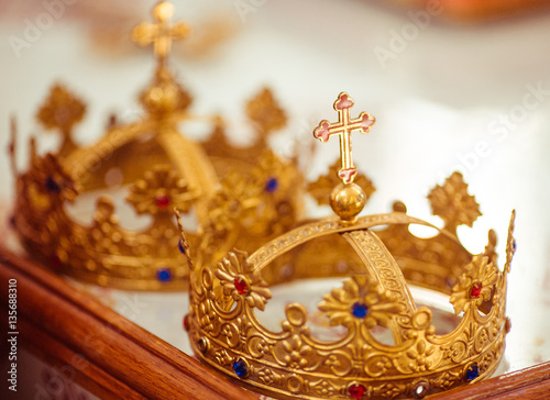 The gold crowns stand on the table