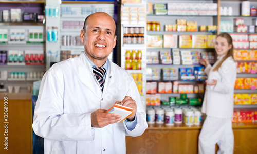 Positive glad pharmacist and pharmacy technician