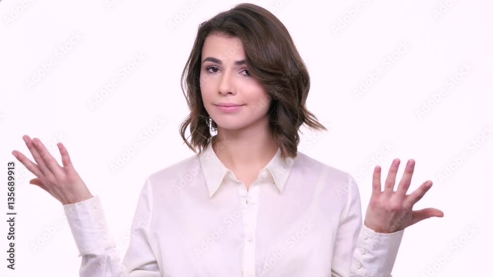 Pretty young girl is not satisfied with her gift isolated on white background Pretty young girl is not satisfied with her gift isolated on white background
