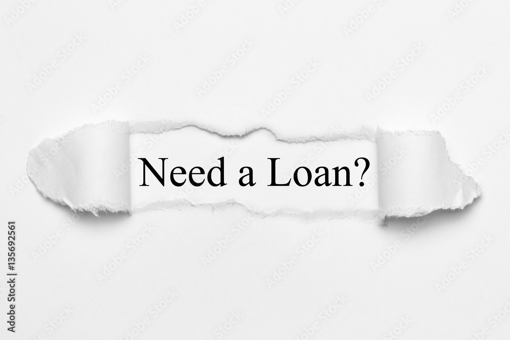 Need a Loan? on white torn paper Need a Loan? on white torn paper