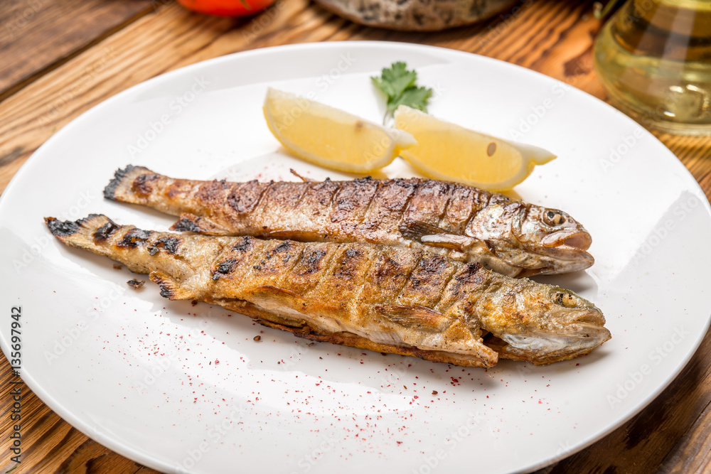 Fish dish - fried fillet with vegetables Fish dish - fried fillet with vegetables