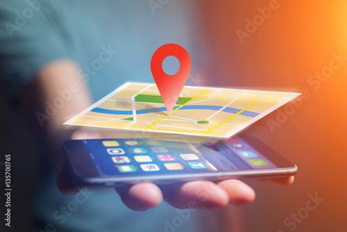 Vuiew of a Concept of geographical localization on a map with a smartphone