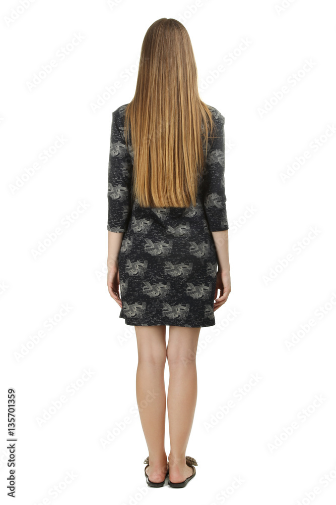 Girl posing in studio with her back on white background isolated. Girl posing in studio with her back on white background isolated.