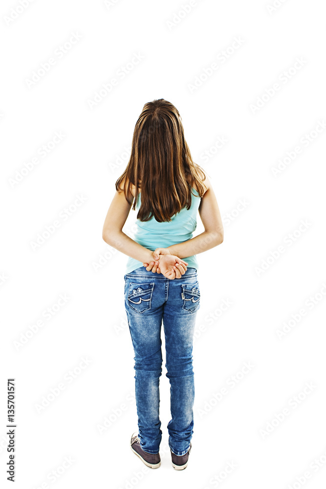 Back view of little girl looking at wall. Rear view. Isolated on white background Back view of little girl looking at wall. Rear view. Isolated on white background