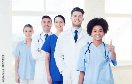 group of happy doctors at hospital