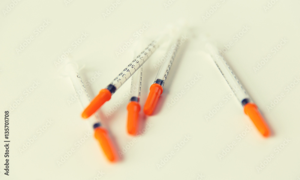 close up of insulin syringes on table