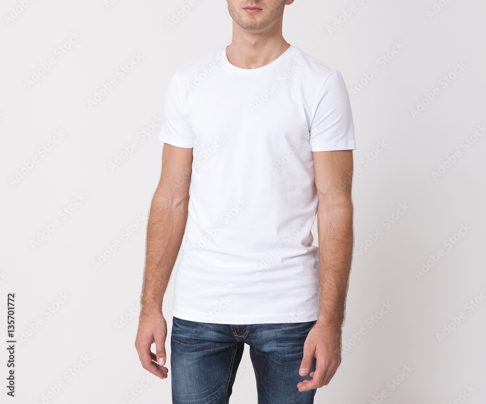 T-shirt design and people concept. Close up of young man in blank white shirt isolated. T-shirt design and people concept. Close up of young man in blank white shirt isolated.