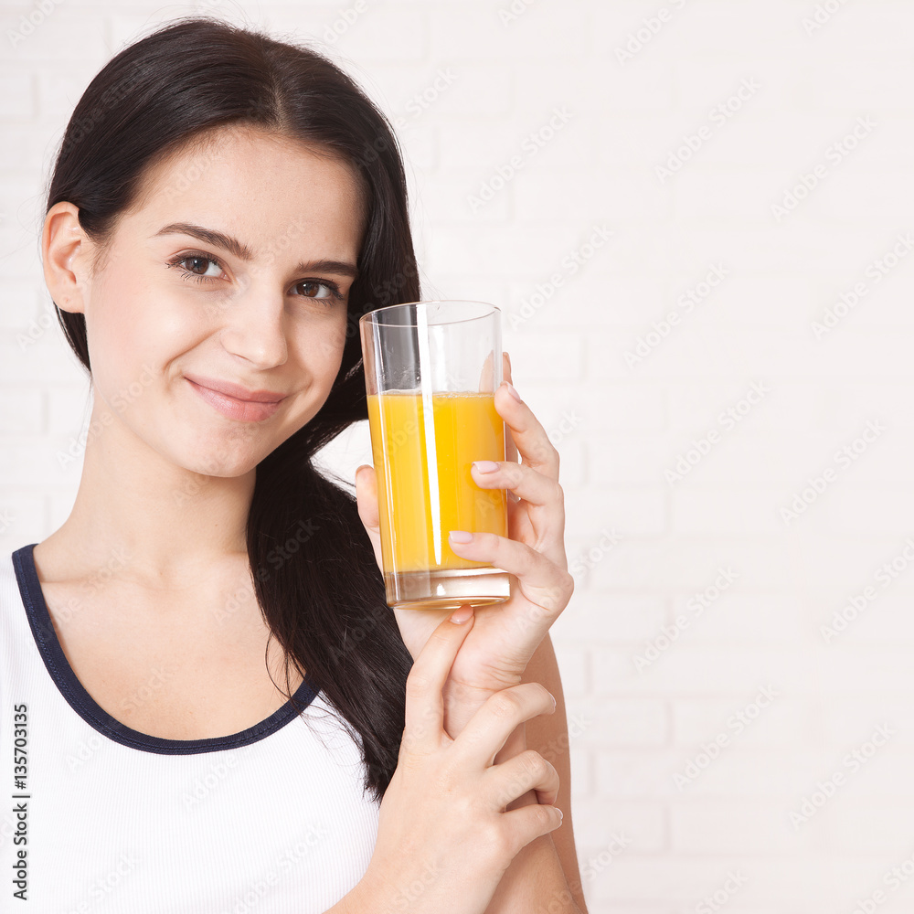 Closeup photo of sexy young woman drinking orange juice Closeup photo of sexy young woman drinking orange juice