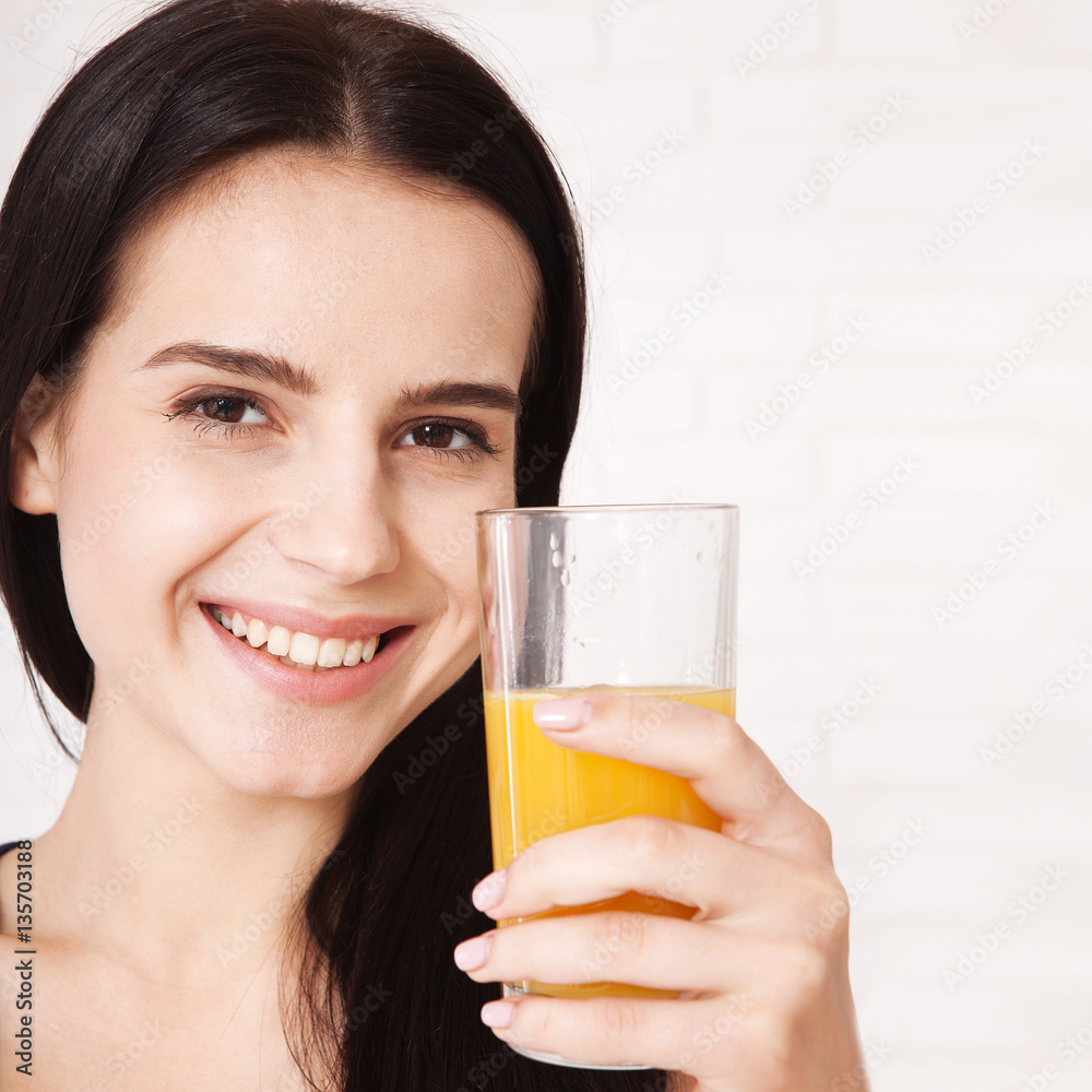 Closeup photo of sexy young woman drinking orange juice Closeup photo of sexy young woman drinking orange juice