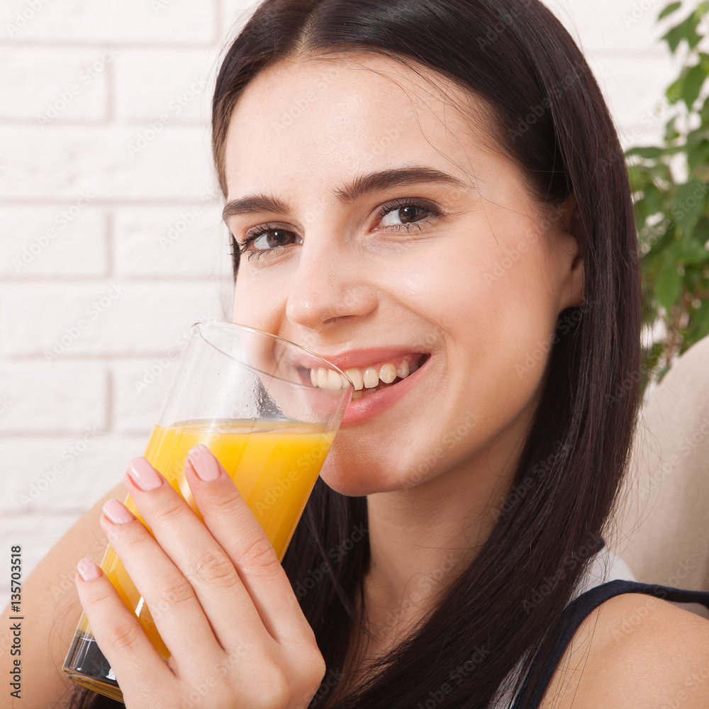 Closeup photo of sexy young woman drinking orange juice Closeup photo of sexy young woman drinking orange juice
