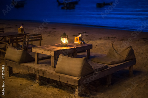 Table in the beach restaurant at night