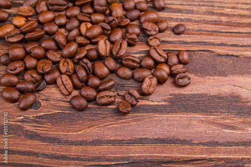 Coffee bearns on a wooden background photo