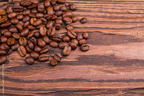 Coffee bearns on a wooden background photo