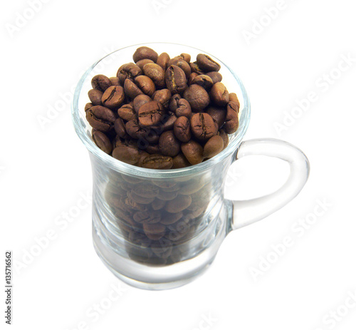 Cofeebeans in glass cup isolated on white backgound photo