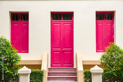 pink Door , pink window on Cream Wall on pink staircase with sma