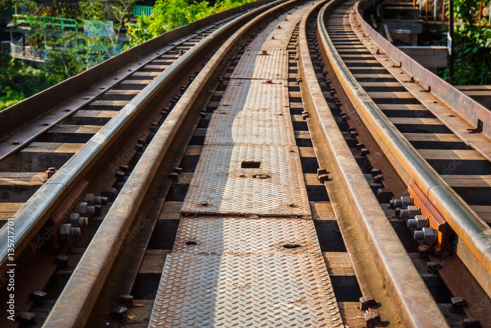 Railroad track curve around a bend in thailand Railroad track curve around a bend in thailand