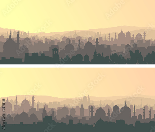 Horizontal wide banners of big muslim city at sunset.