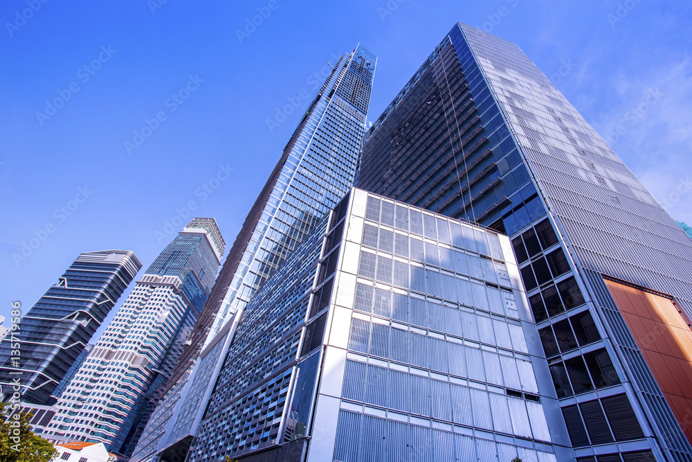 View of modern office buildings and blue sky View of modern office buildings and blue sky